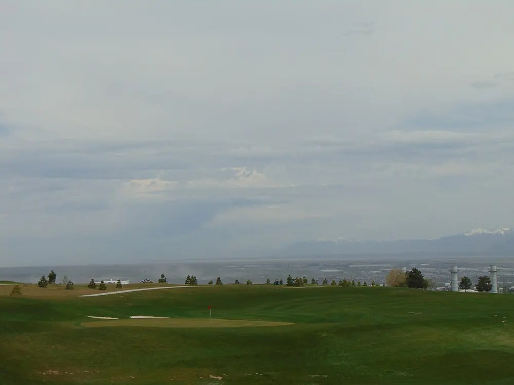 Glenmoor fairways and a bunker, with the Salt Lake Valley beyond