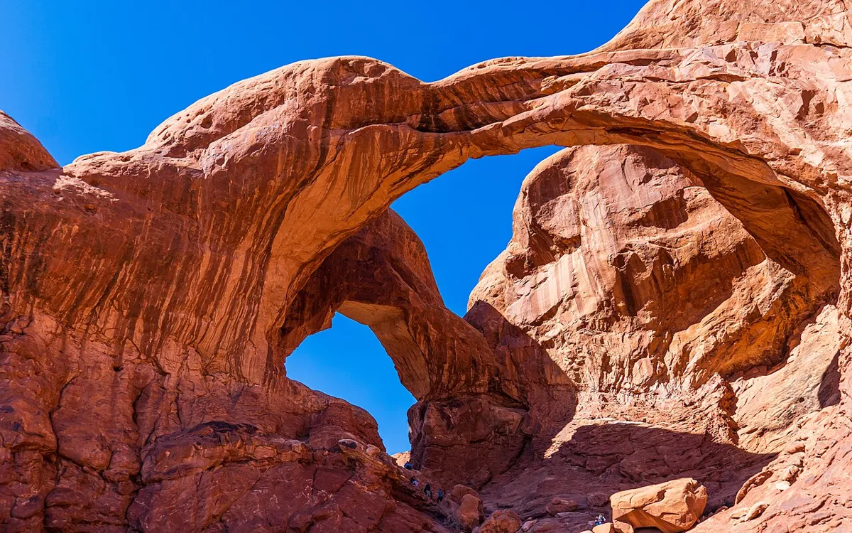 Double Arch against a blue sky in Arches National Park