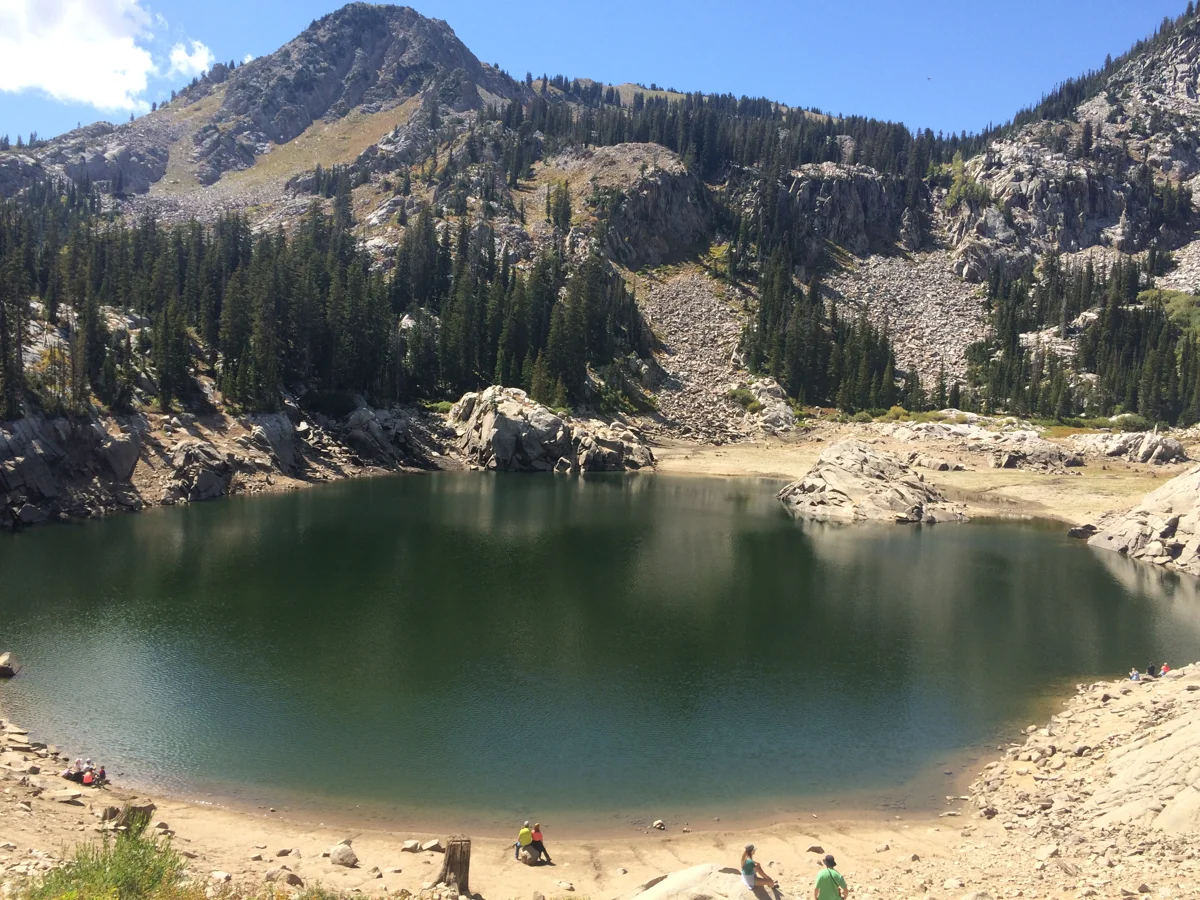 Lake Mary beneath rocky slopes and conifers near Brighton