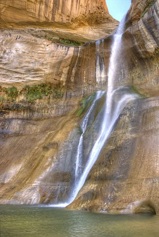 Lower Calf Creek Falls descending past sandstone walls into a pool