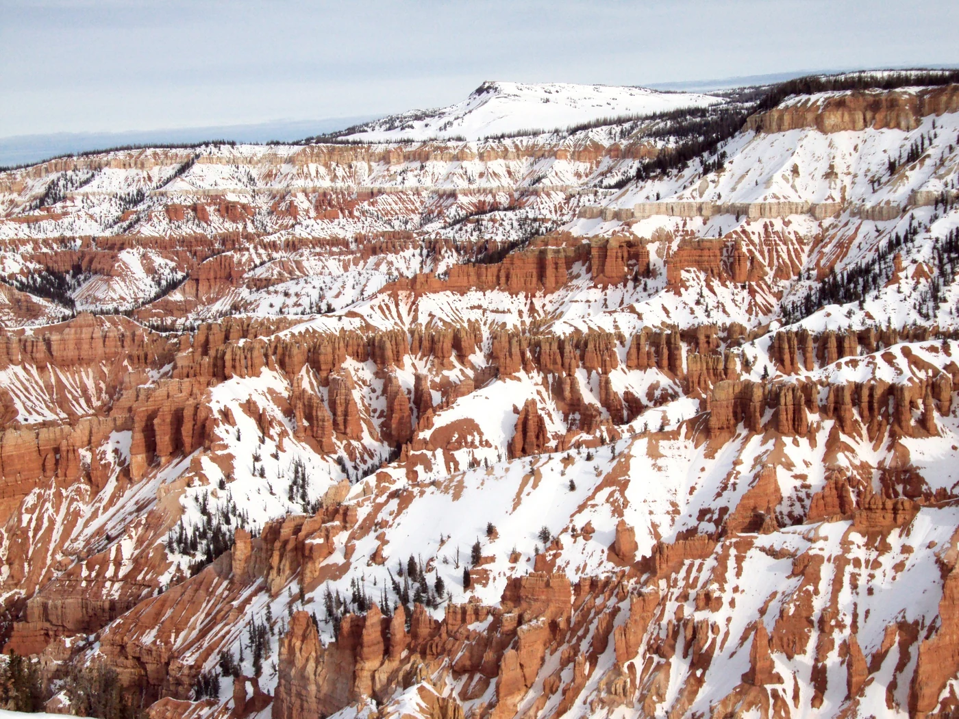 Winter snow on the red and orange spires of the Cedar Breaks Amphitheater