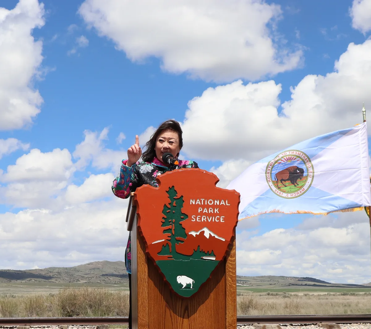 Utah state Sen. Karen Kwan speaking at a podium at Golden Spike National Historical Park, May 11, 2024