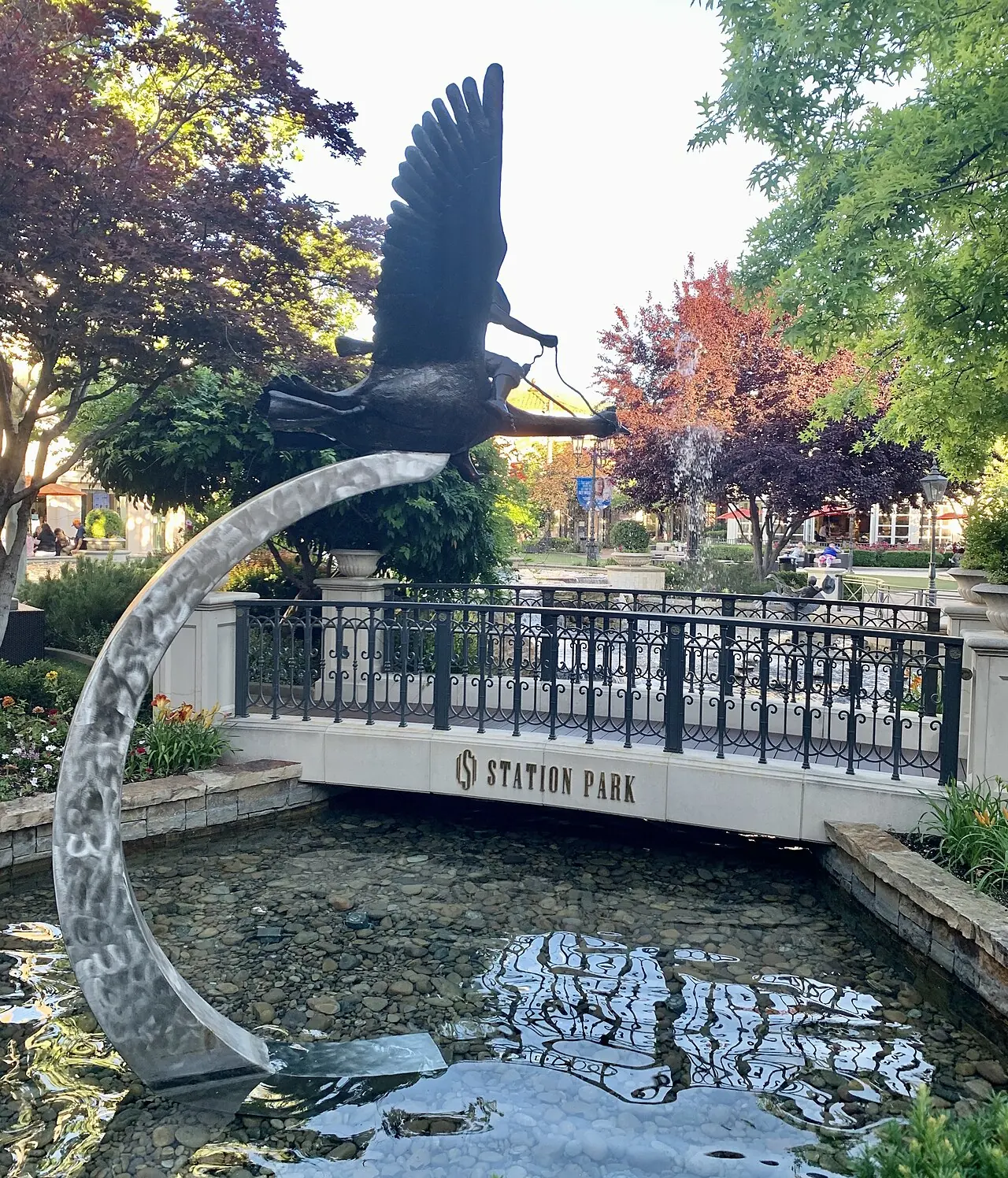 A bridge and water feature at Station Park in Farmington