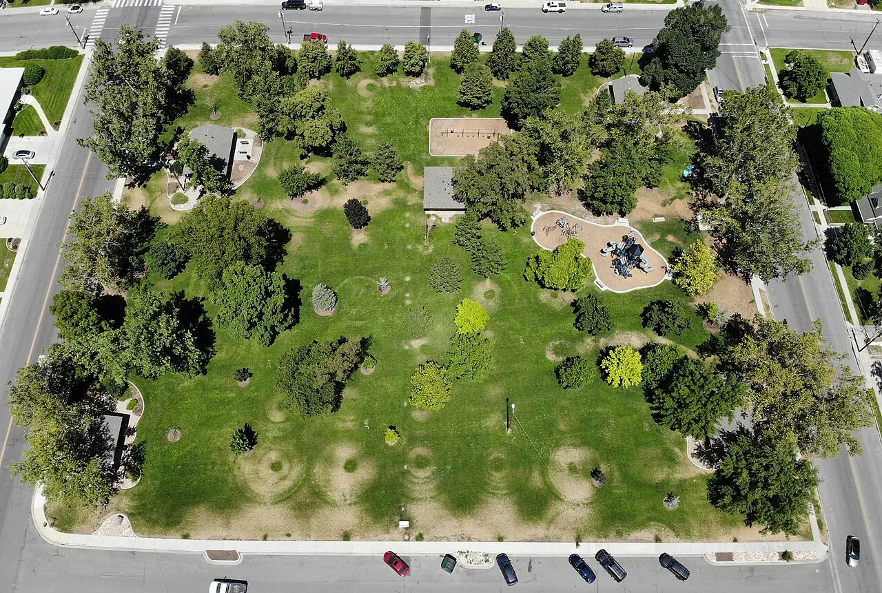 An aerial view of paths and mature trees in Wines Park in Lehi
