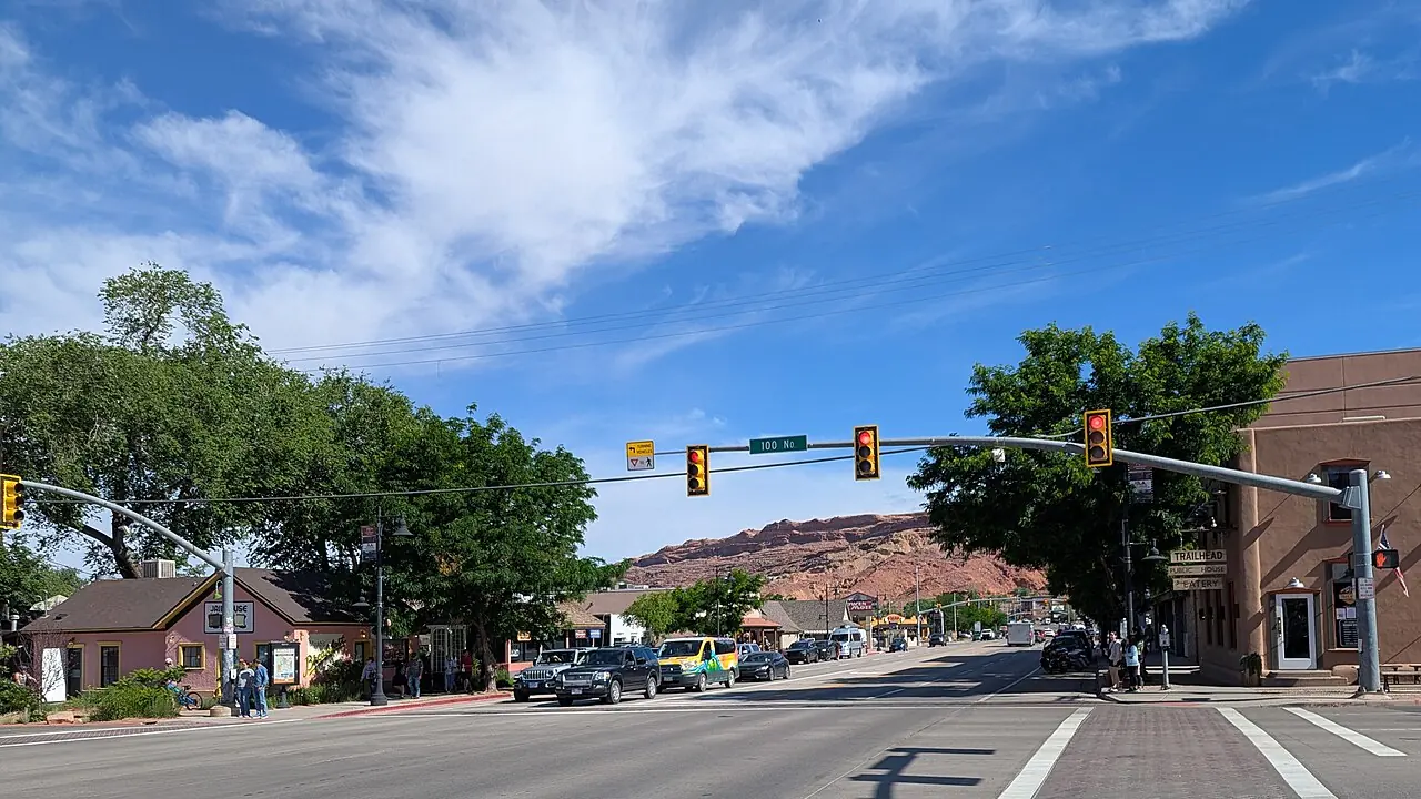 Main Street and red-rock cliffs in Moab