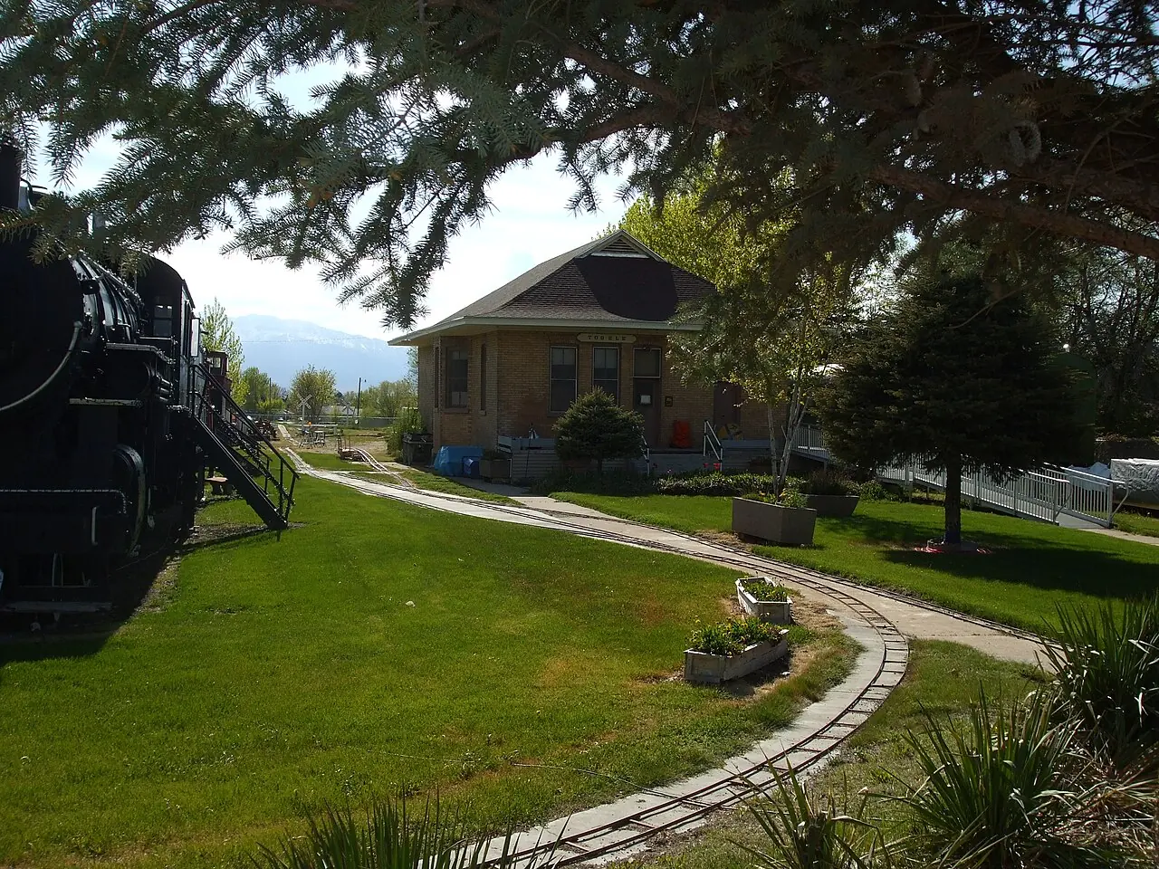 Historic railroad equipment and a building at the Tooele Valley Railroad Complex