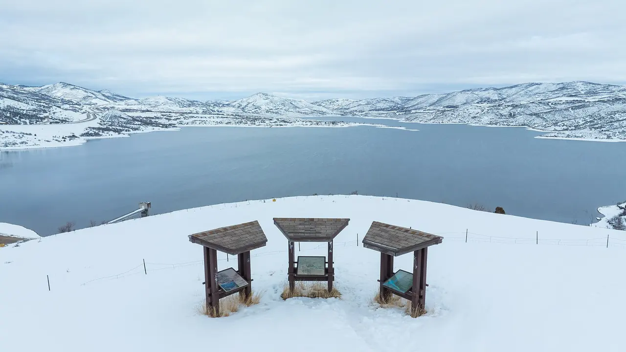 Jordanelle Reservoir surrounded by snow-covered hills, seen from the state park overlook in winter