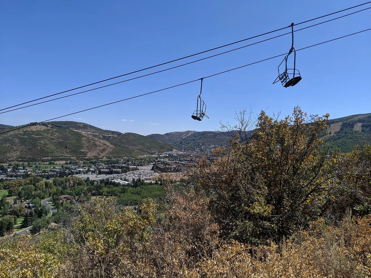 Silver Star chairlift rising above the base area of Park City Mountain