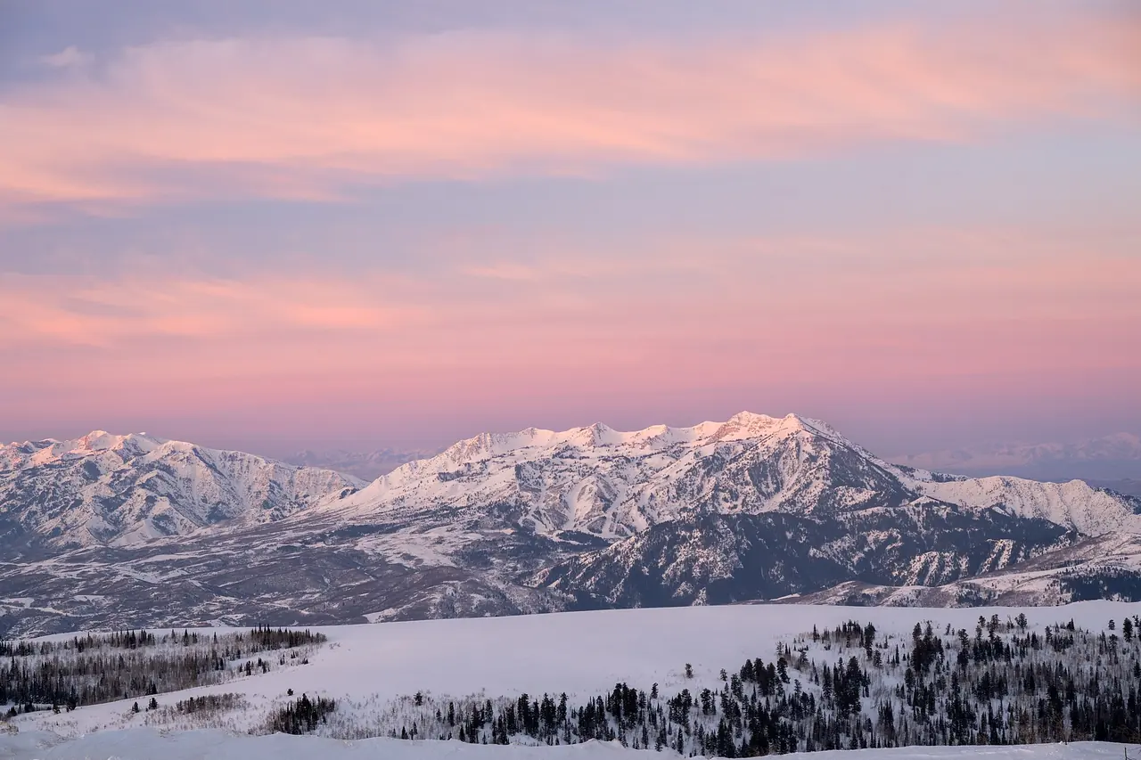 Sunrise light spreading over the mountains, seen from Powder Mountain above Eden