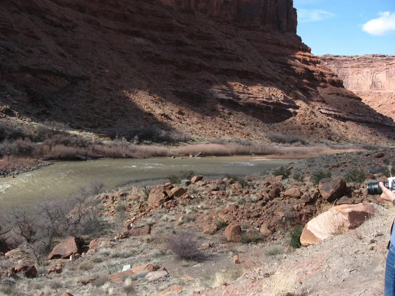 Utah State Route 128 following the Colorado River between red sandstone cliffs near Moab